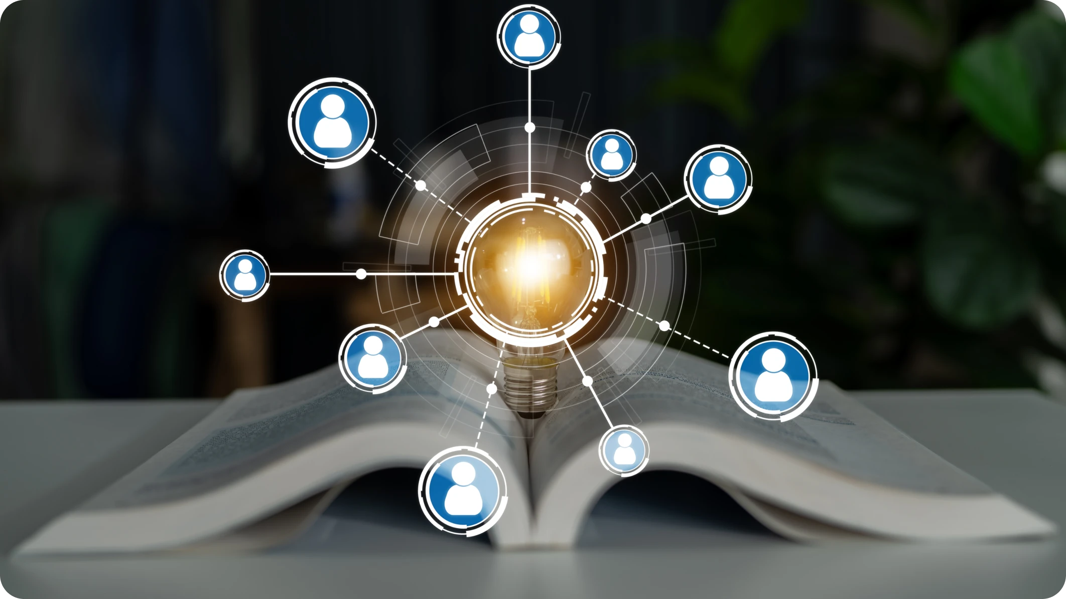 Open book on a desk with overlay diagram featuring profile icons coming from an orb symbolizing knowledge base automation.