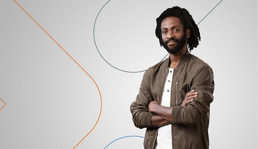 Man standing in front of white Experis background