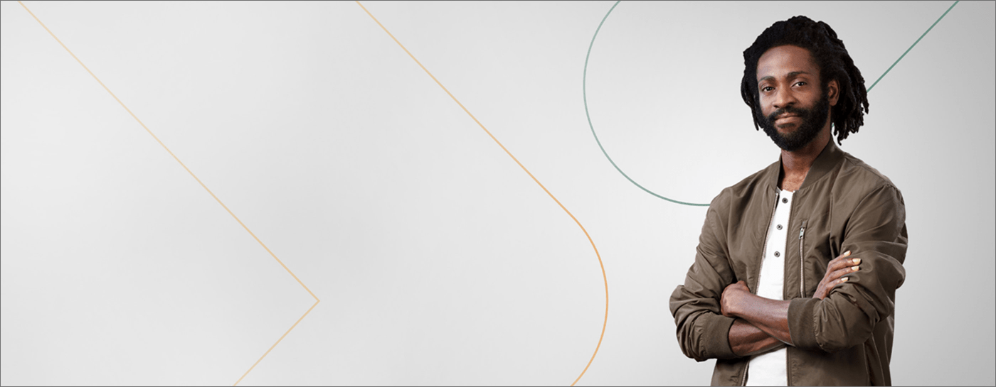 Man in casual attire with white Experis background