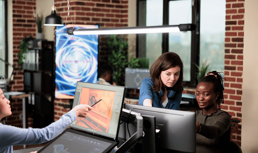 two women working at computer in a office