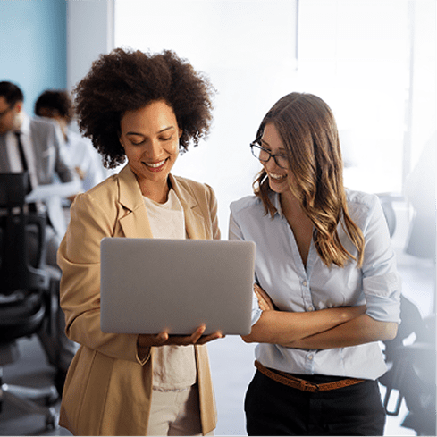 two women looking at laptop