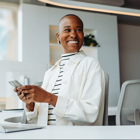 woman in white jacket sitting